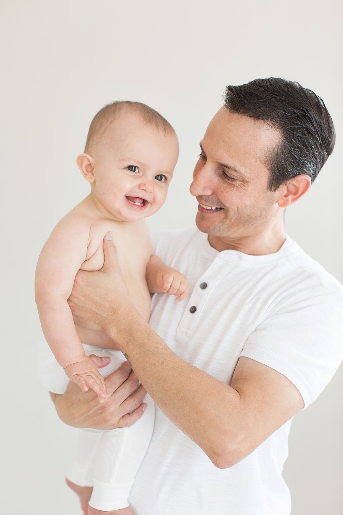 Dad laughs and plays with son at Julie Brock Photography in Louisville KY