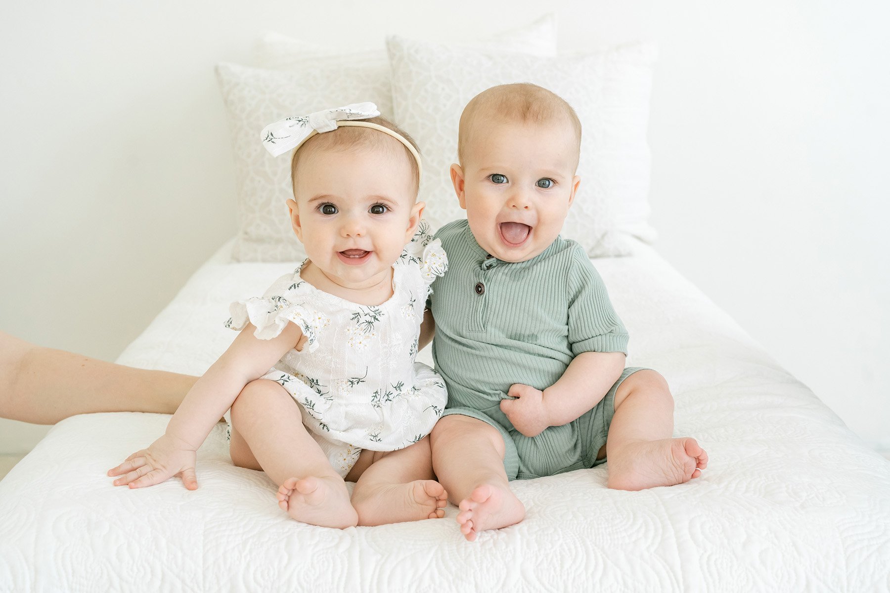 Six month old twins laugh during a family photo shoot in Louisville Ky with Julie Brock Photography