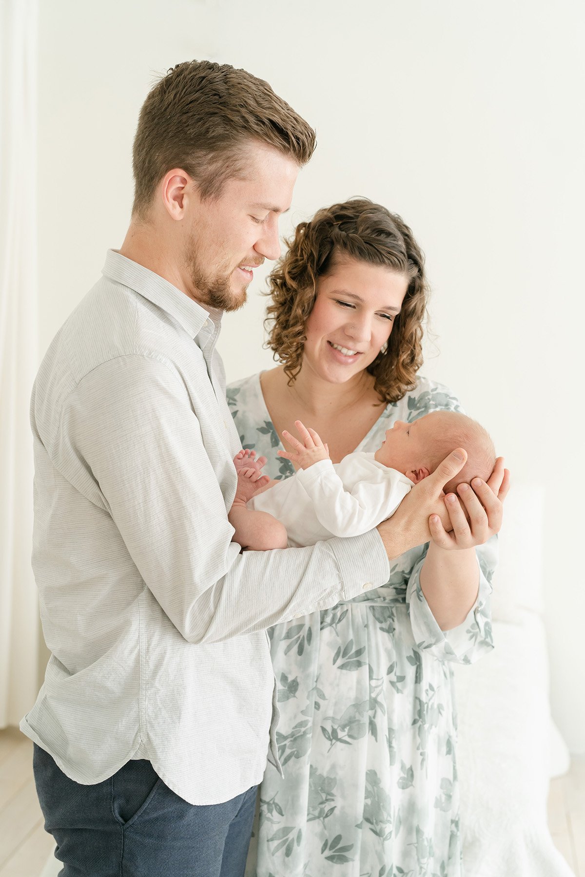 Simple natural posing of parents with newborn baby boy at Julie Brock Photography Studio in Middletown KY