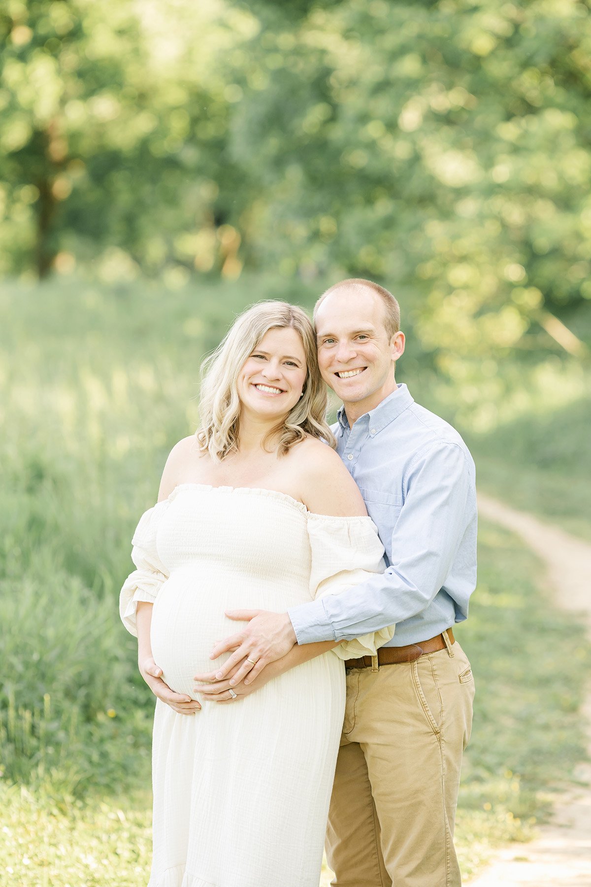 Proud pregnant parents pose at Louisville Ky park for outdoor maternity photos with Julie Brock Photography