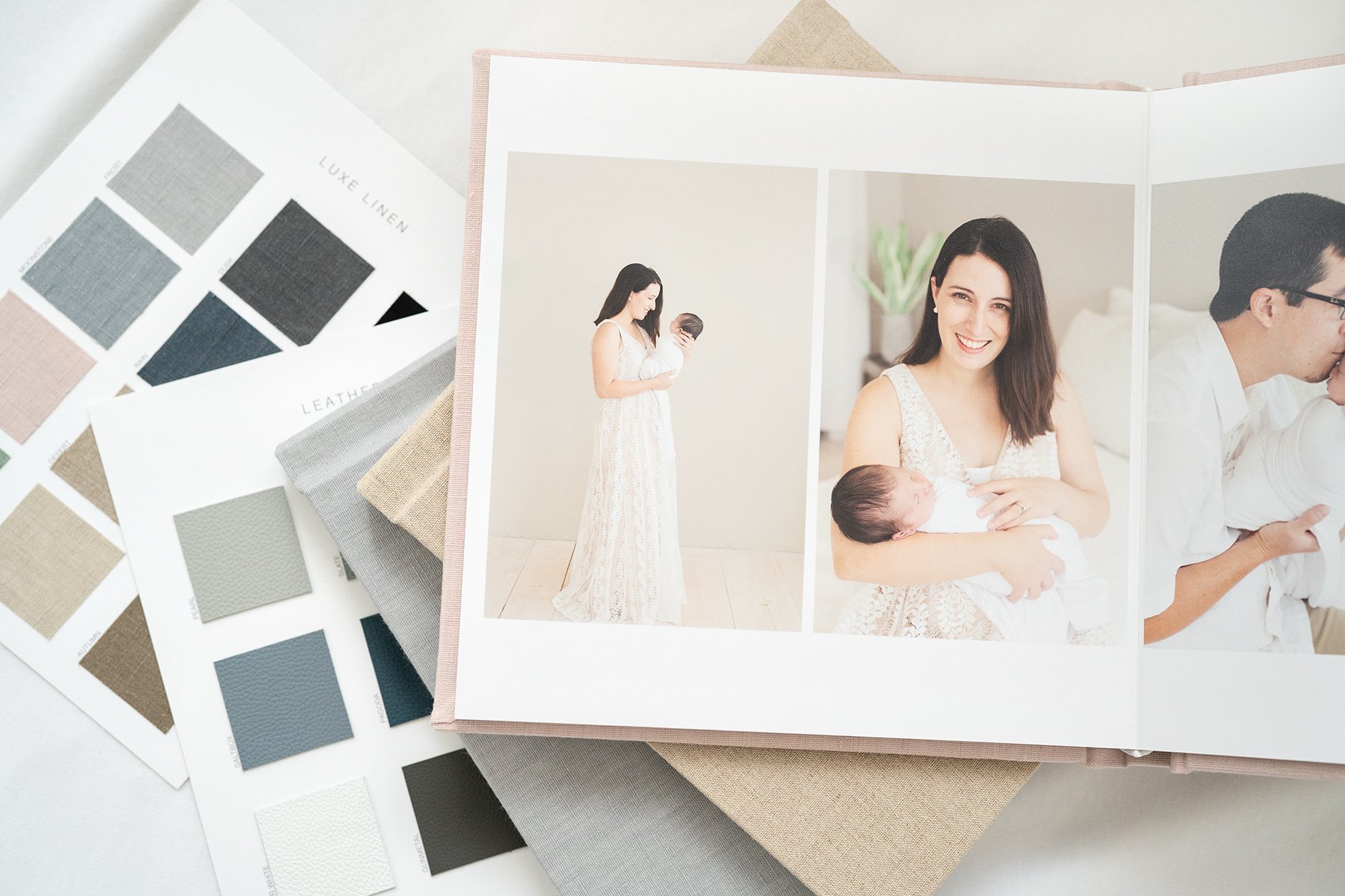 High quality, linen newborn photo album with images of mom holding newborn baby taken at Louisville KY photography studio