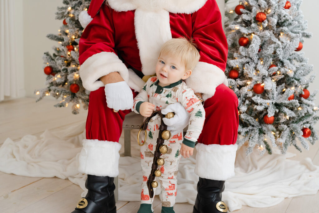 Little boy looks at Santa during Photos with Santa in Louisville Ky at Julie Brock Photography