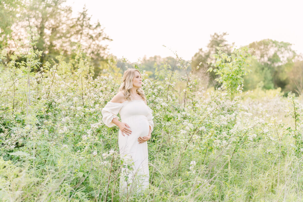 Outdoor photoshoot in field of white flowers with Julie Brock Photography