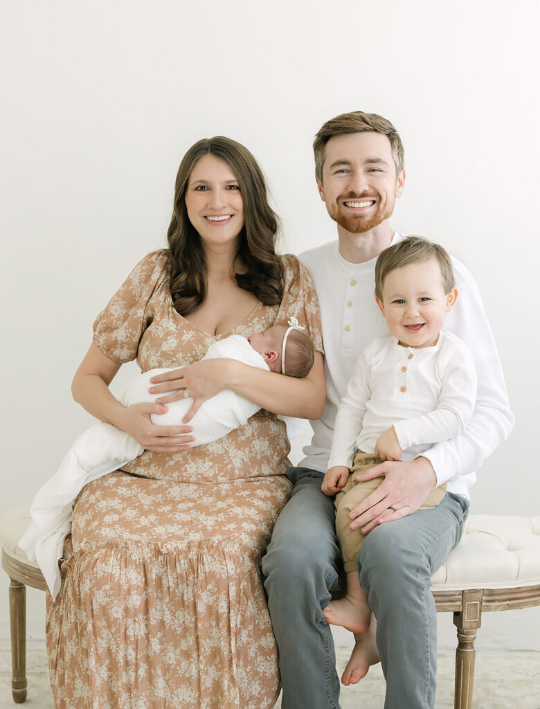 Louisville family photographer, Julie Brock, takes photo of newborn baby and parents