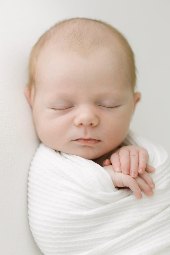 natural posing for newborn image at Louisville newborn photography studio with Julie Brock