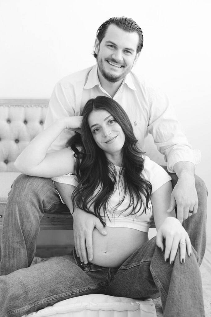 Pregnant mother poses with her husband for a relaxed yet modern Maternity Photo Session near Louisville KY